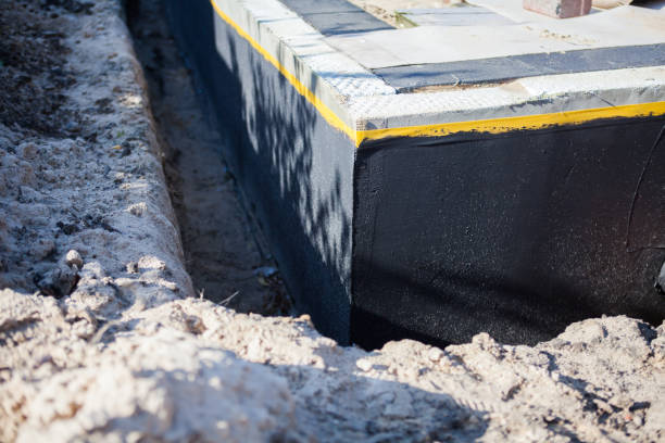 Professional Basement Waterproofing technician working in Adams, WI